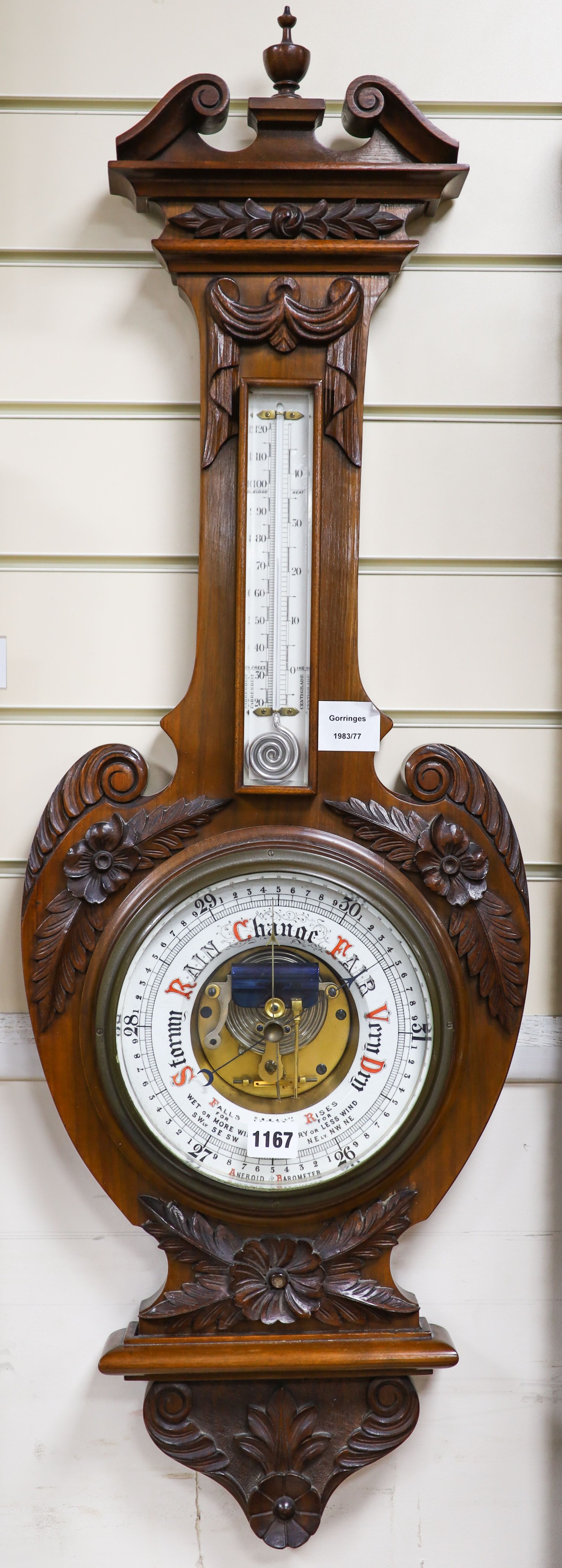 An Edwardian carved walnut cased aneroid barometer and thermometer, height 99cm